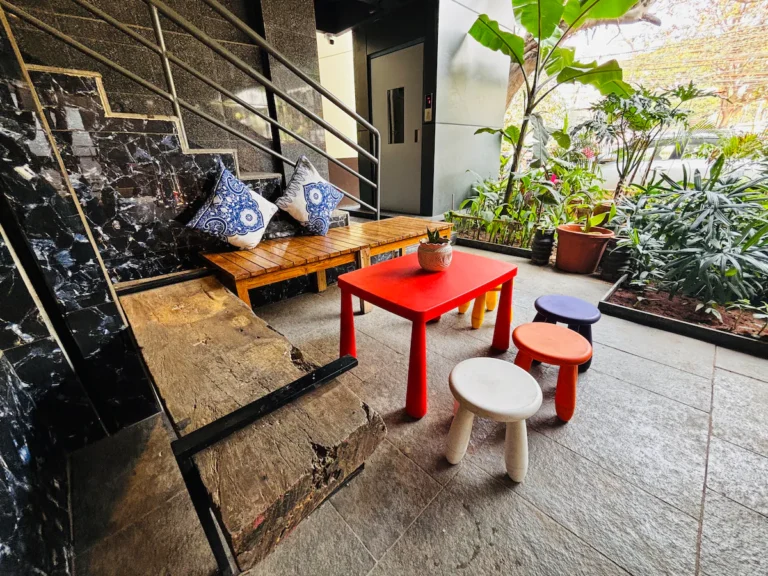 East Wing Twin Room + Balcony, Café Vibes Below!